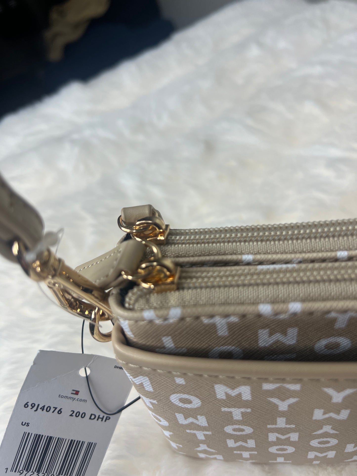 Tommy Hilfiger faux leather logo gold zipper wristlet wallet.